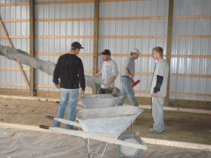 Pouring a pole barn floor.