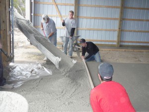 Pouring pole barn floor using 4500 psi concrete. 